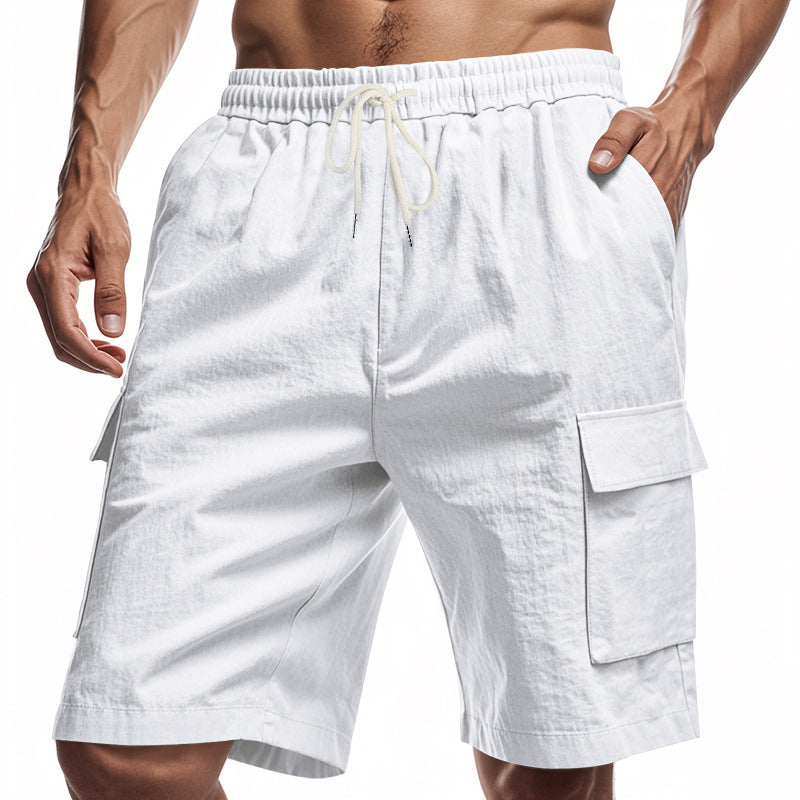 White cargo shorts worn by a person on a white background