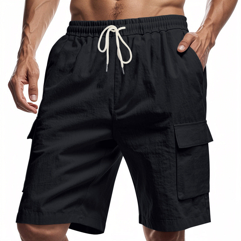 Black cargo shorts with a drawstring on a white background
