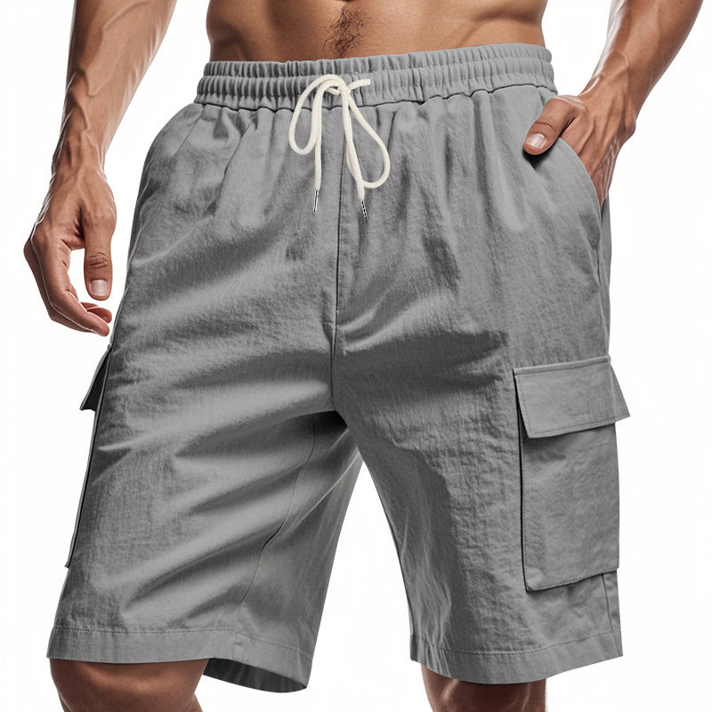 Gray cargo shorts with a drawstring on a white background