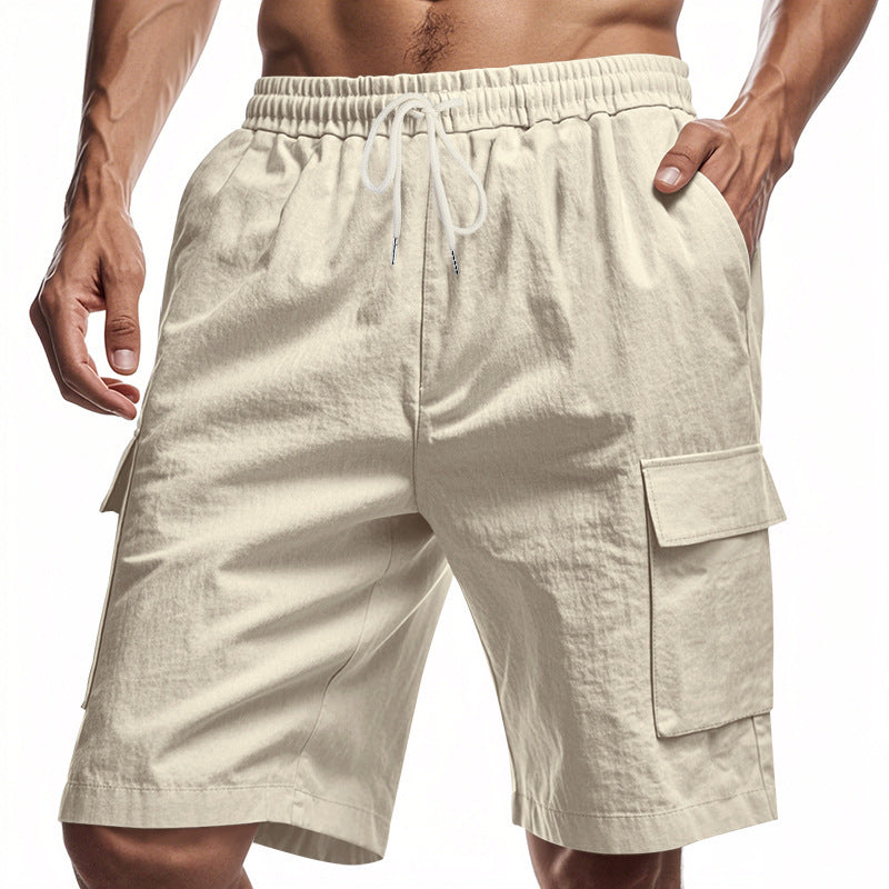 Beige cargo shorts worn by a person on a white background