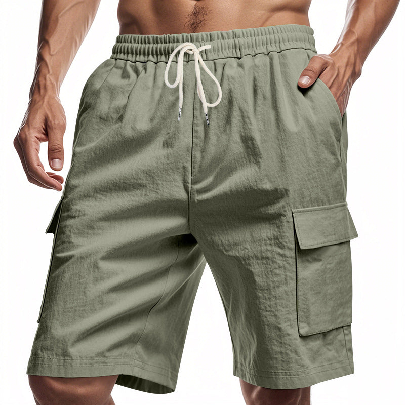 Green cargo shorts with a drawstring on a white background