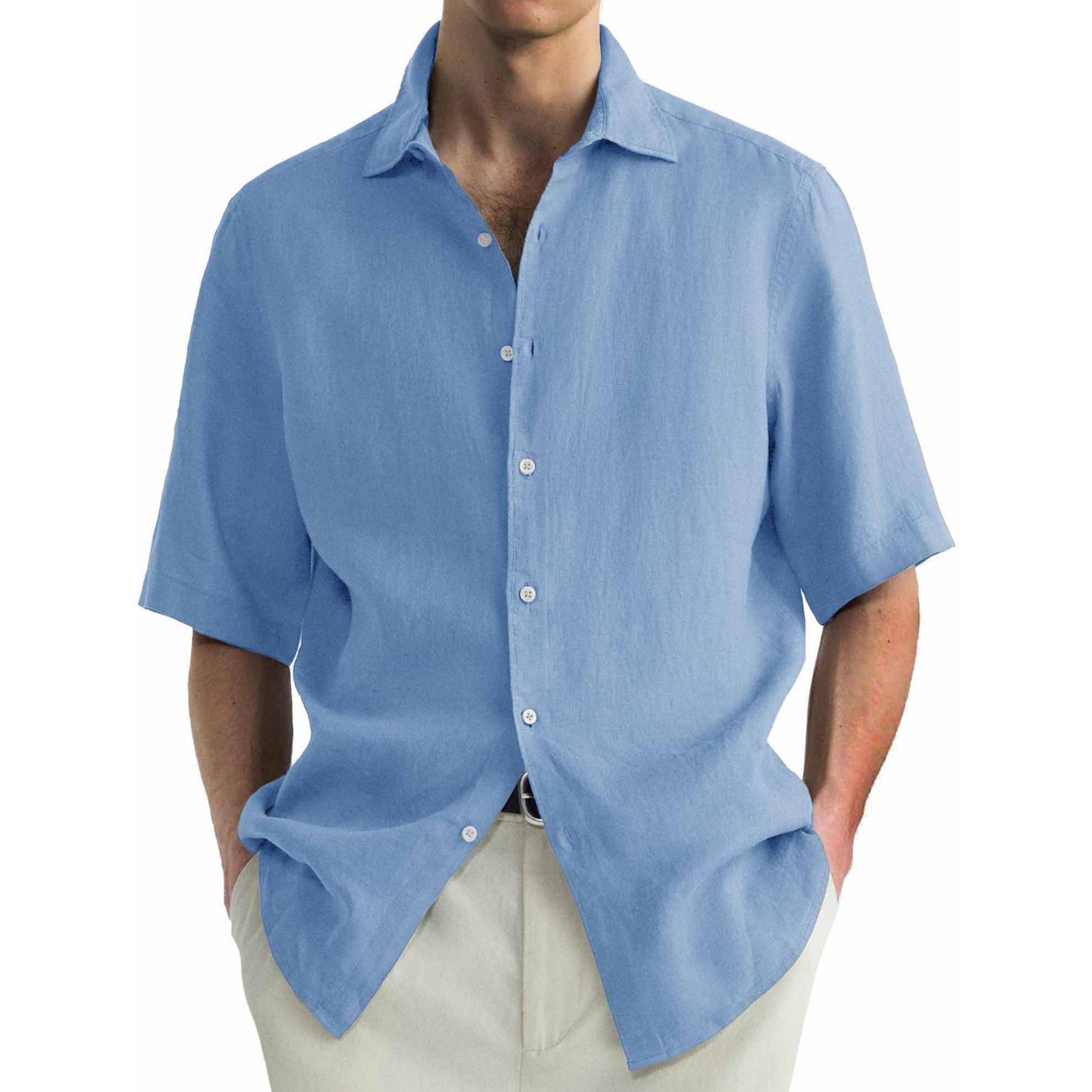 Blue short-sleeve shirt worn by a person on a white background