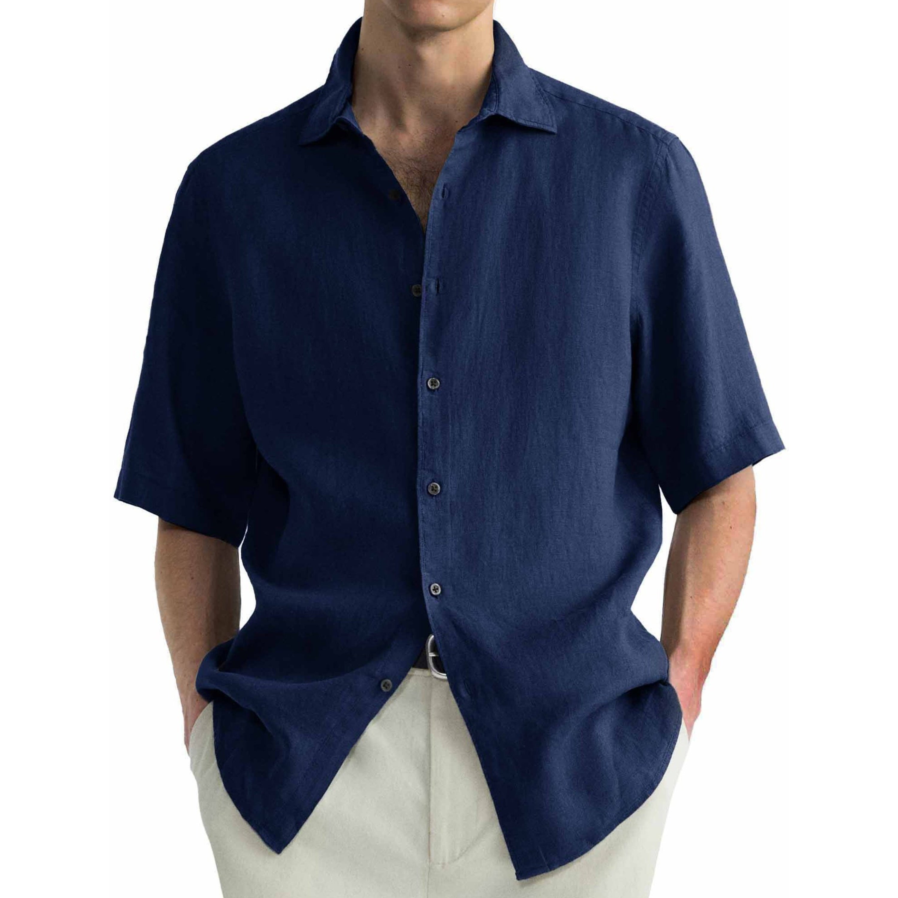 Navy blue short-sleeve shirt worn by a person on a white background.