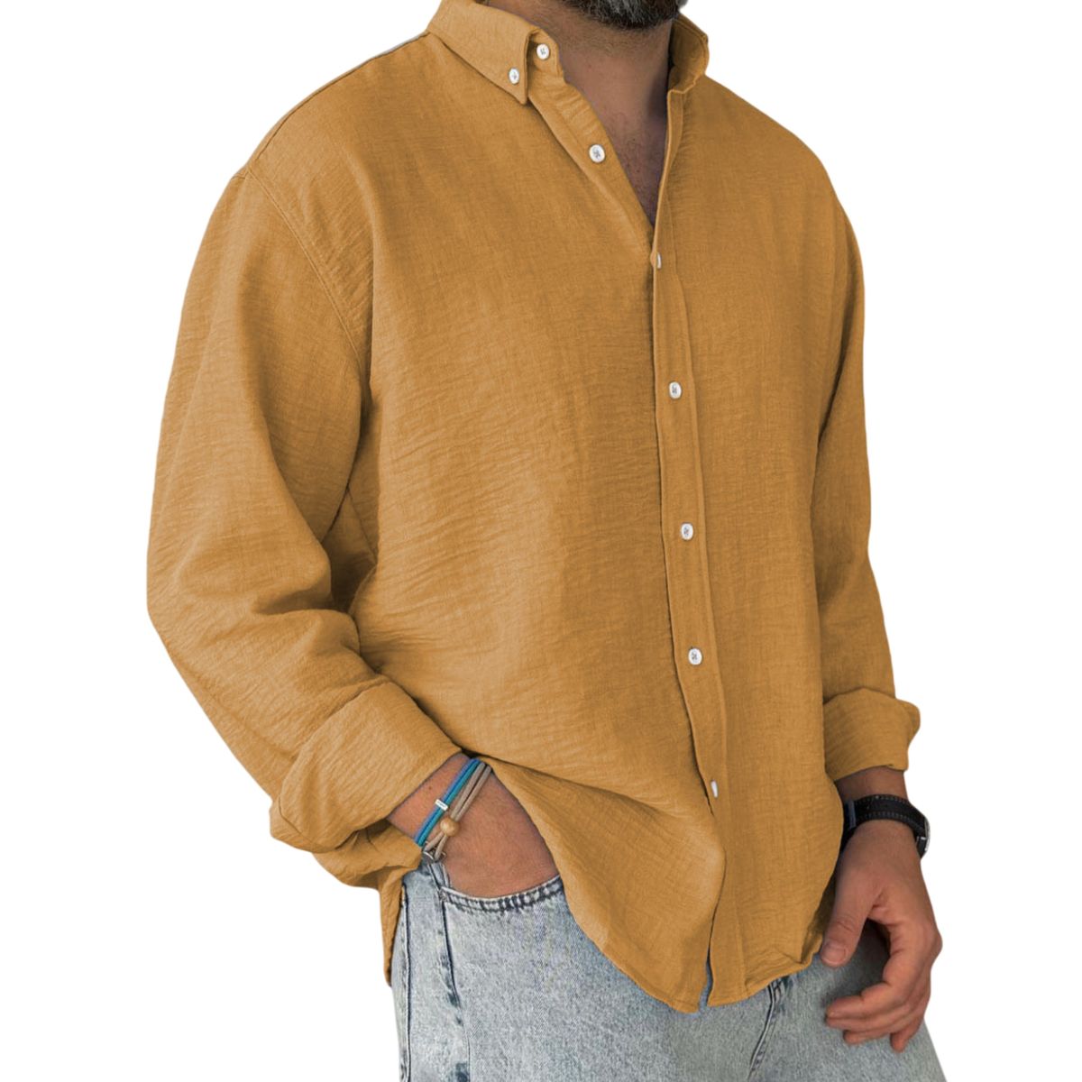 Man wearing a mustard yellow shirt with rolled-up sleeves on a white background