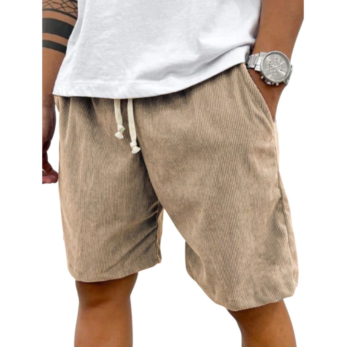Beige shorts worn by a person on a white background