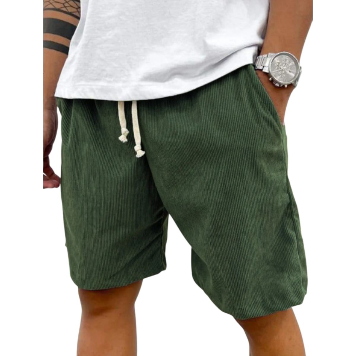 Green corduroy shorts worn by a person on a white background