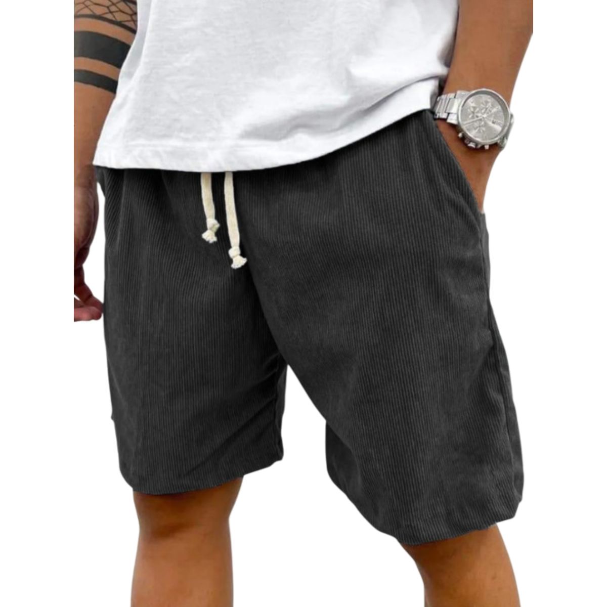 Person wearing dark gray shorts with a white drawstring, white shirt, and silver watch on a white background.