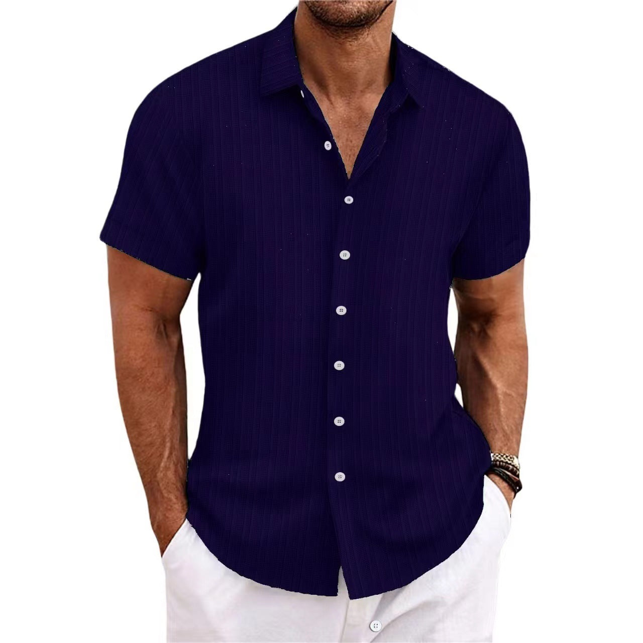 Man wearing a navy blue short-sleeve shirt on a white background