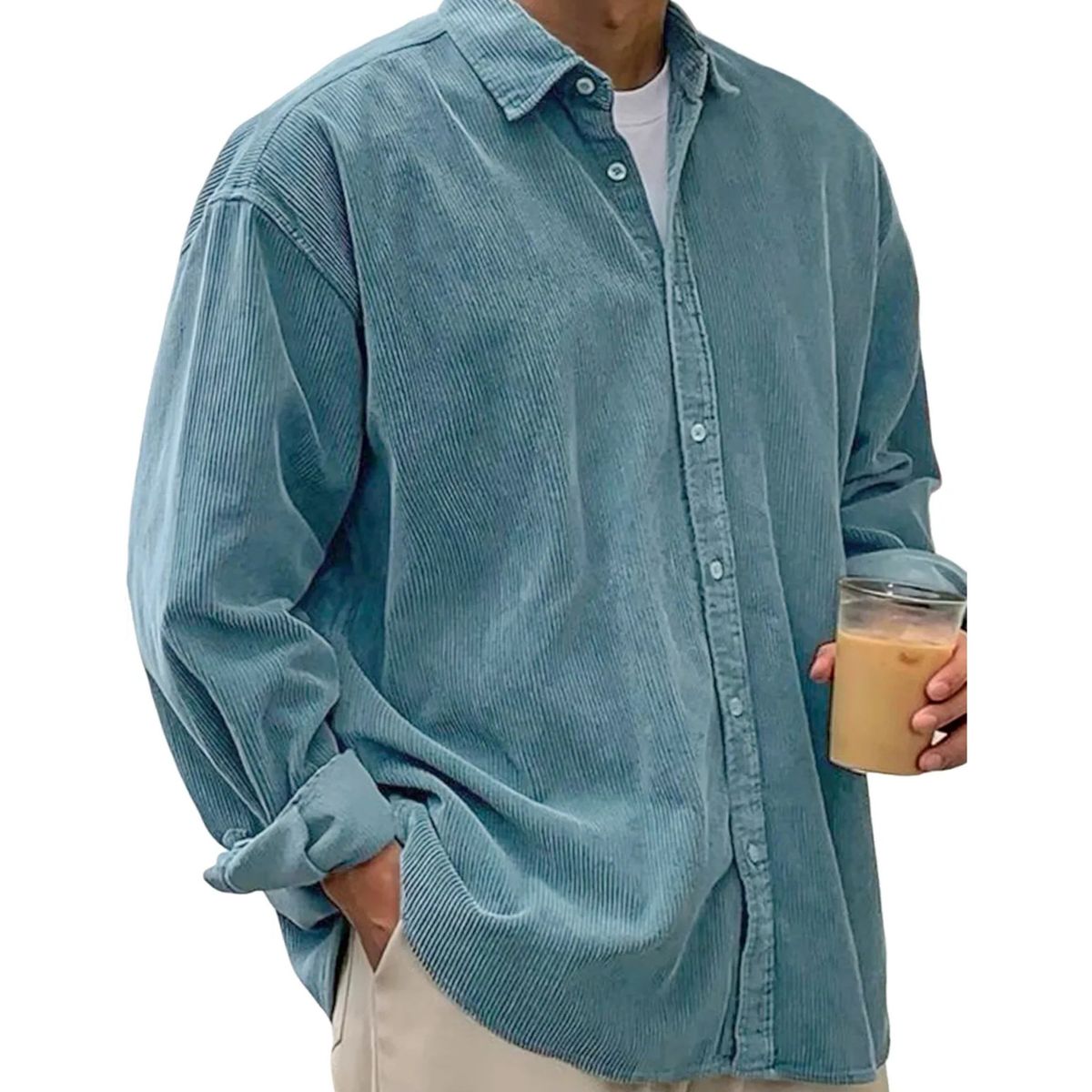 Person wearing a light blue corduroy shirt holding a cup.
