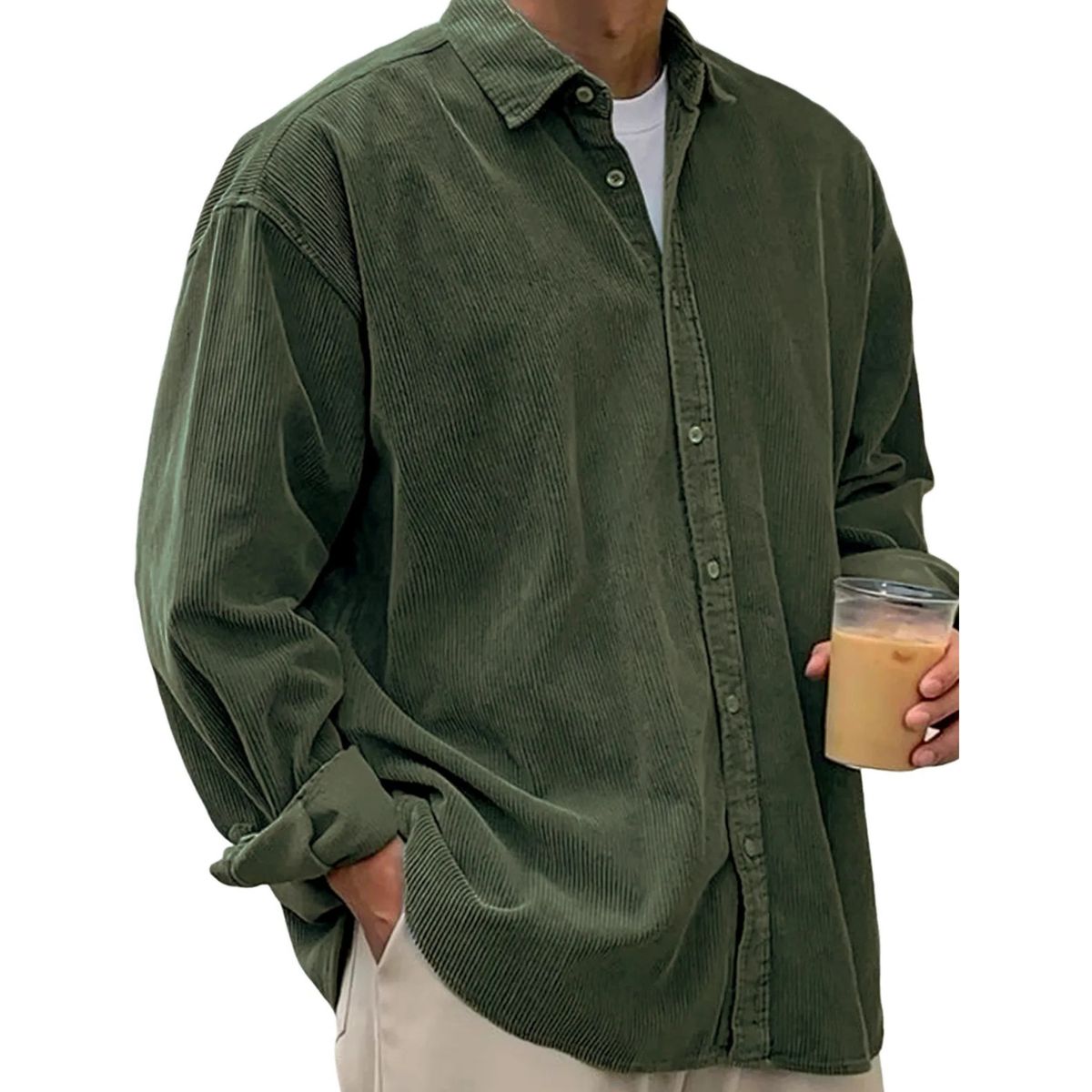 Person wearing a olive corduroy shirt holding a glass of iced coffee on a white background
