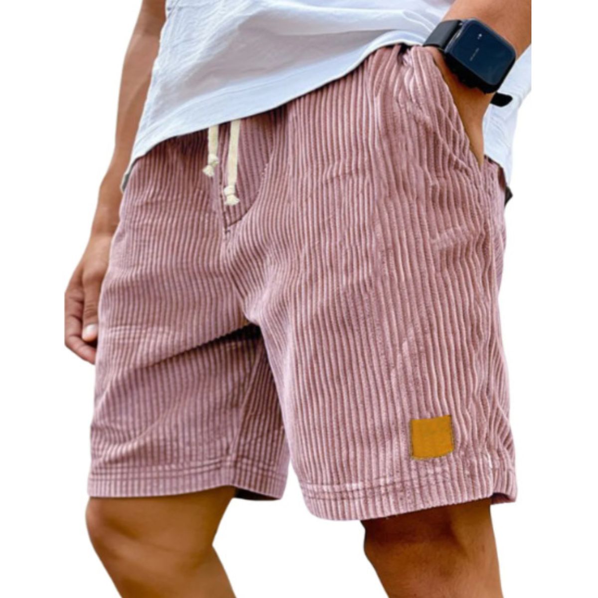 Person wearing pink striped shorts with a white background