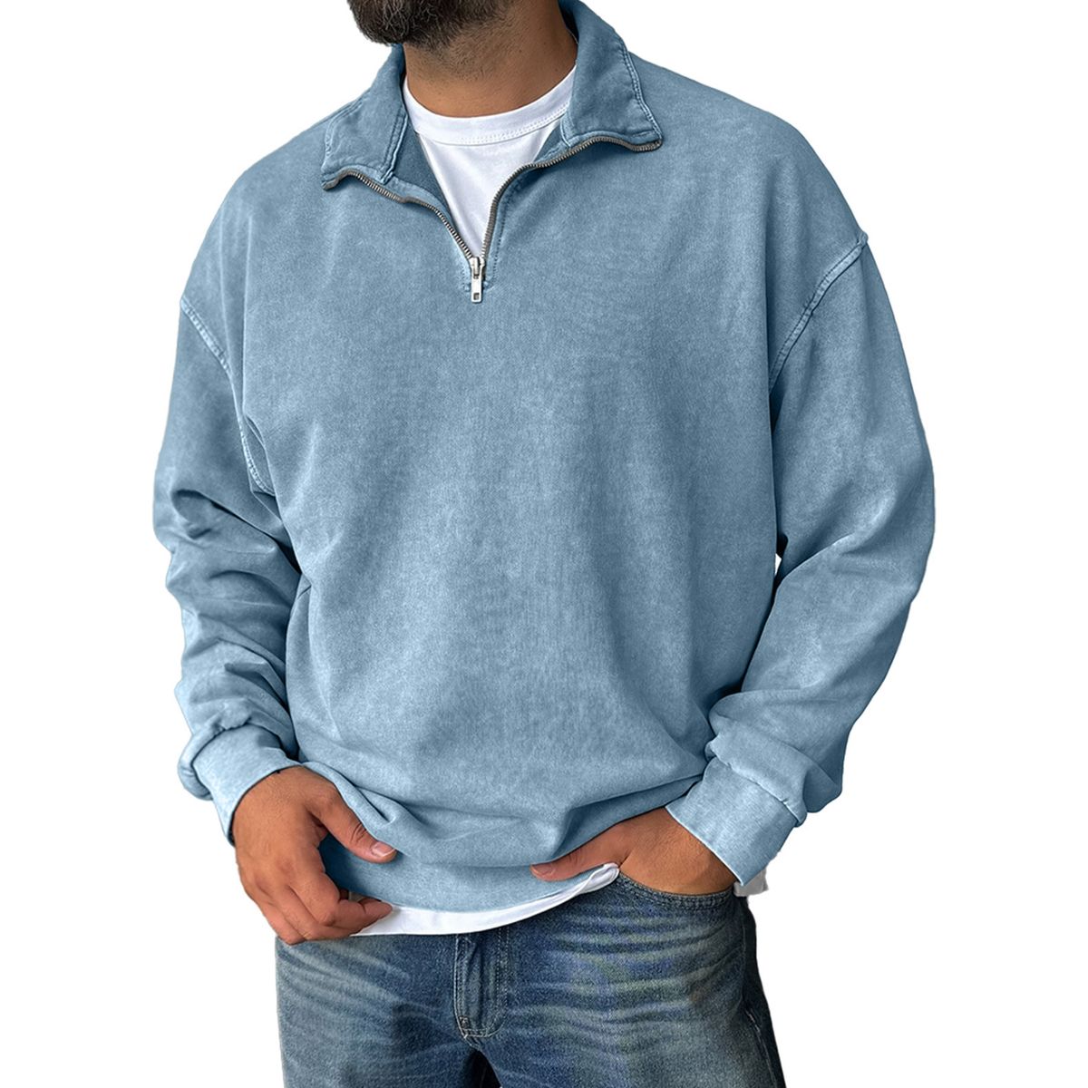 Man wearing a light blue pullover with a zipper on a white background