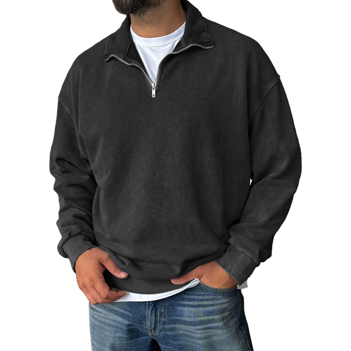 Person wearing a dark gray pullover with a zipper on a white background