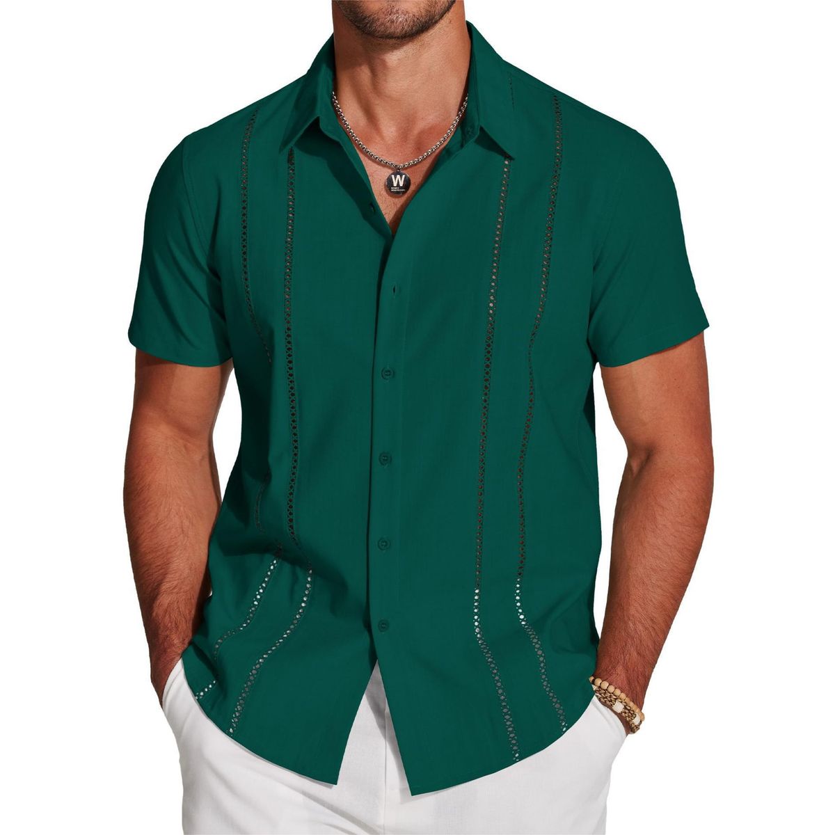 Man wearing a green short-sleeve shirt with decorative stitching on a white background
