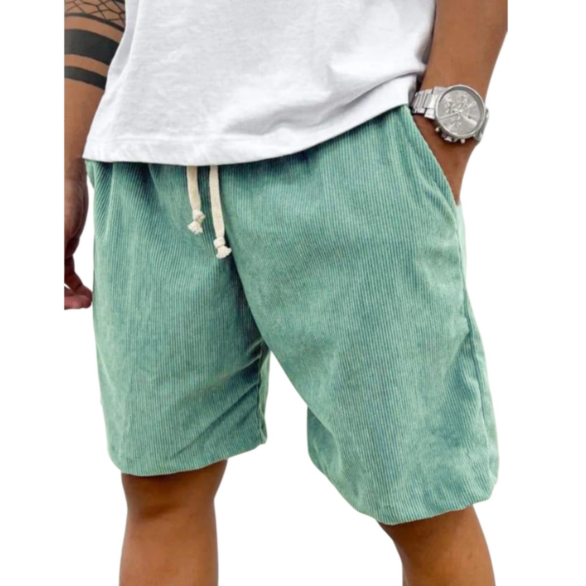Green shorts worn by a person on a white background