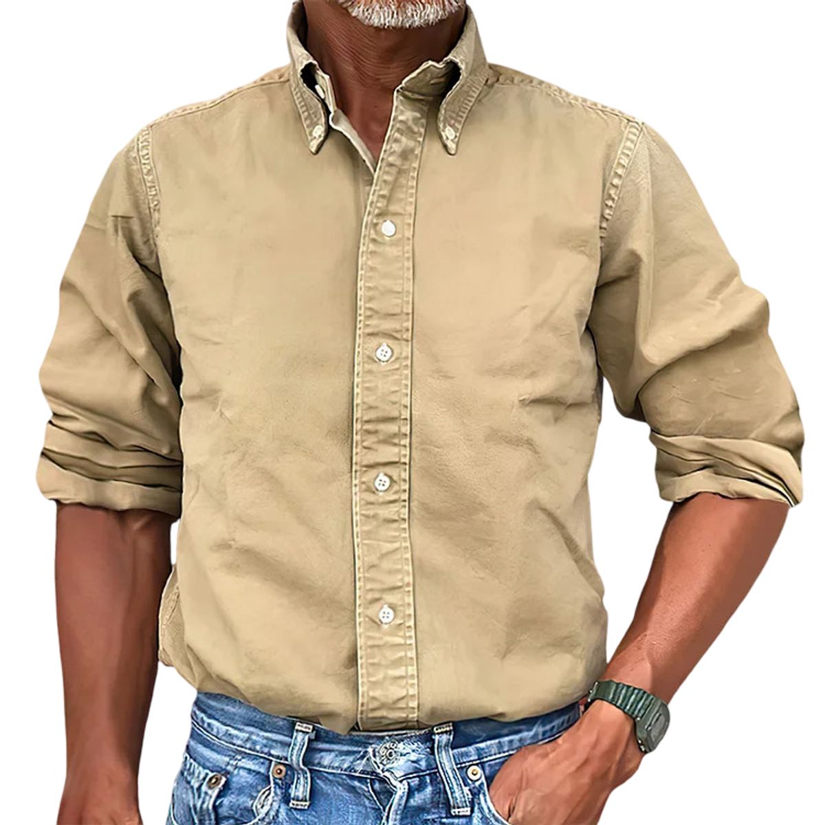 Man wearing a beige button-up shirt and blue jeans on a white background