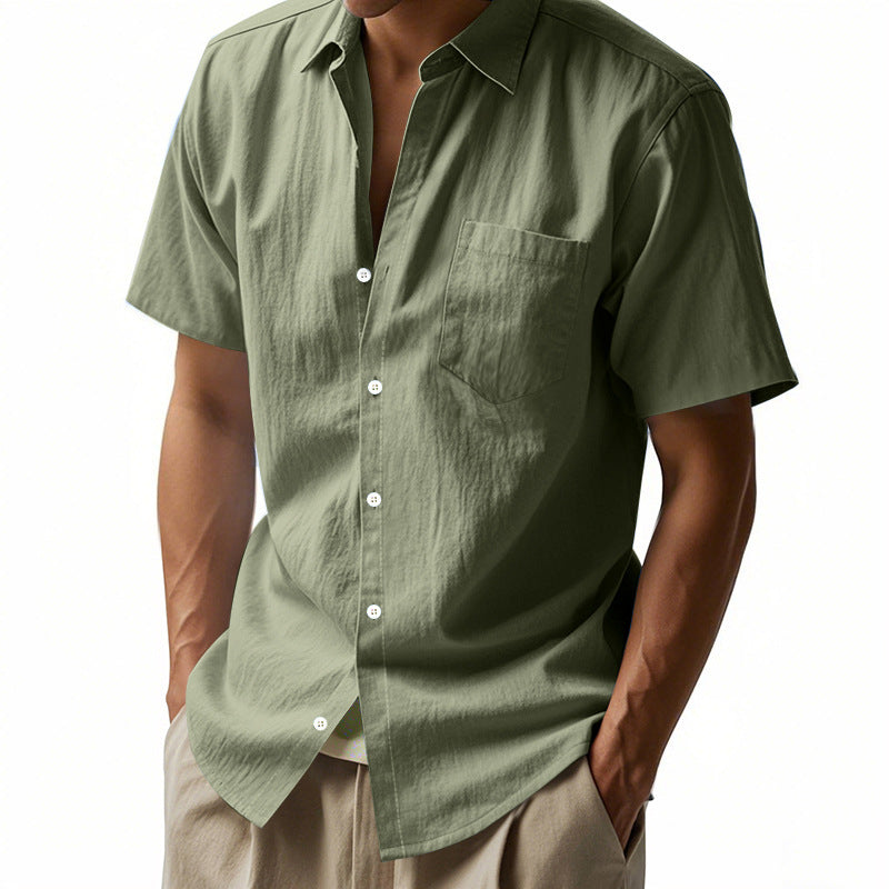Green short-sleeve shirt worn by a person on a white background