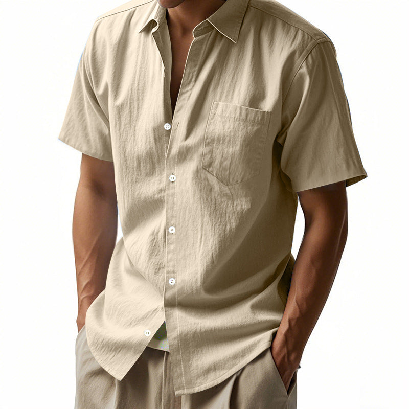 Beige short-sleeve shirt worn by a person on a white background