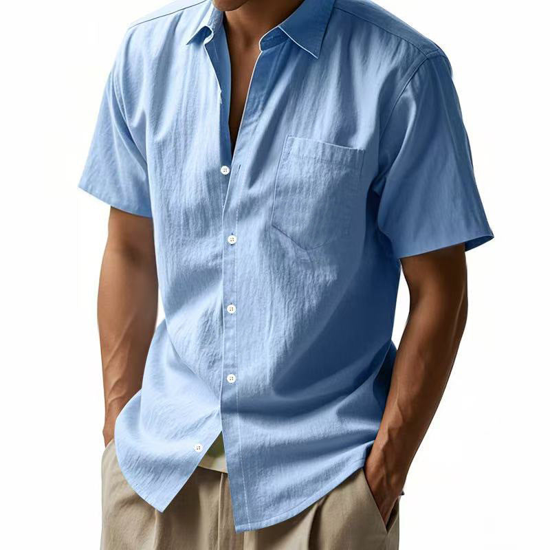 Light blue short-sleeve shirt worn by a person on a white background