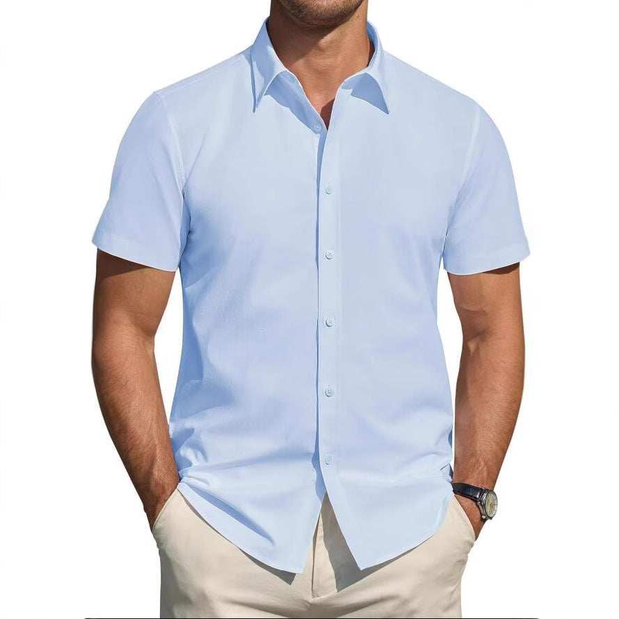 Man wearing a light blue short-sleeve shirt with a white background