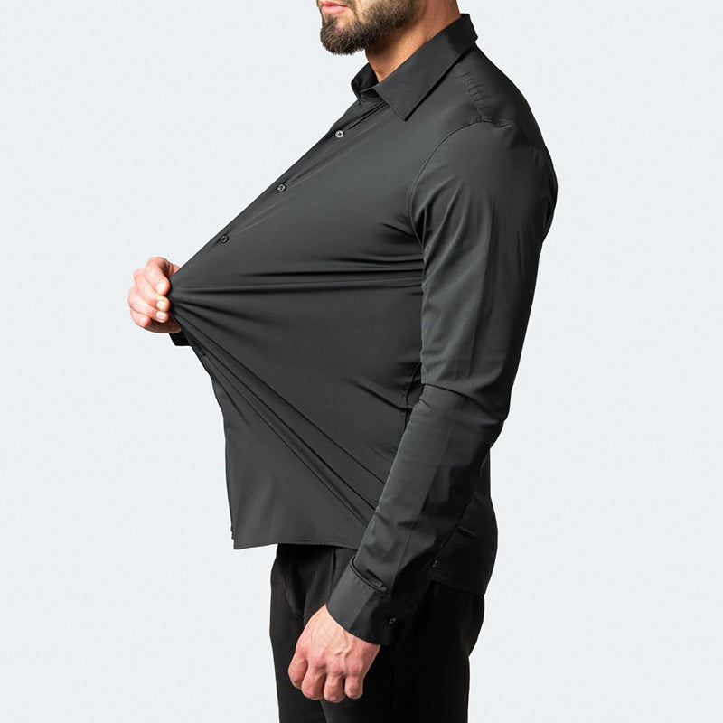 Man wearing a black dress shirt with a unique cutout design on a light gray background