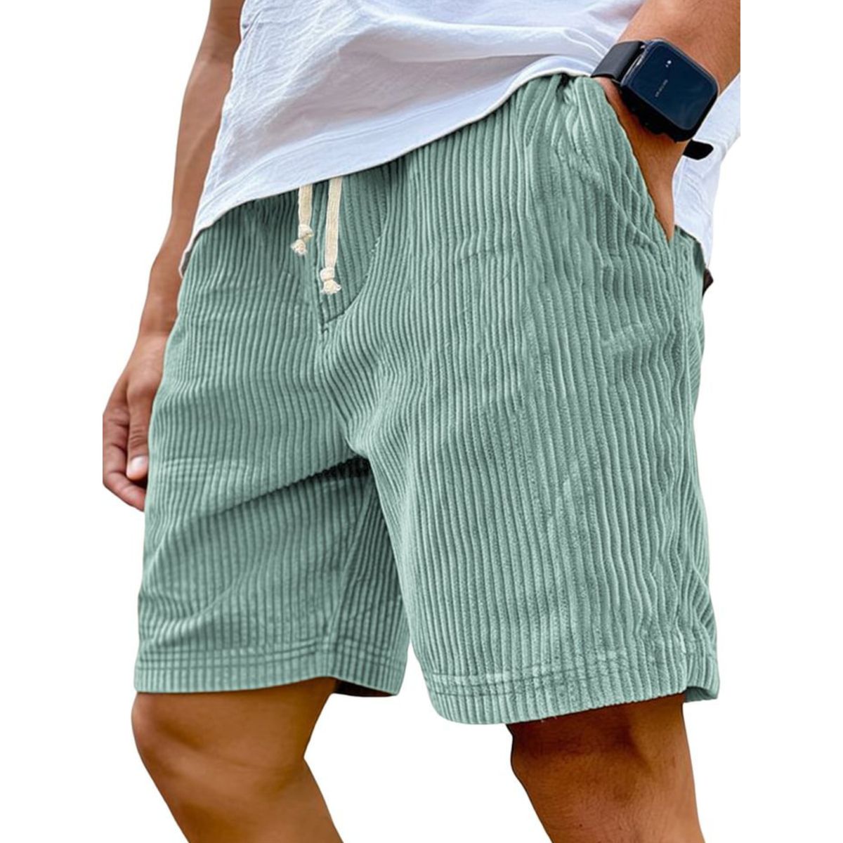 Green striped shorts worn by a person on a white background