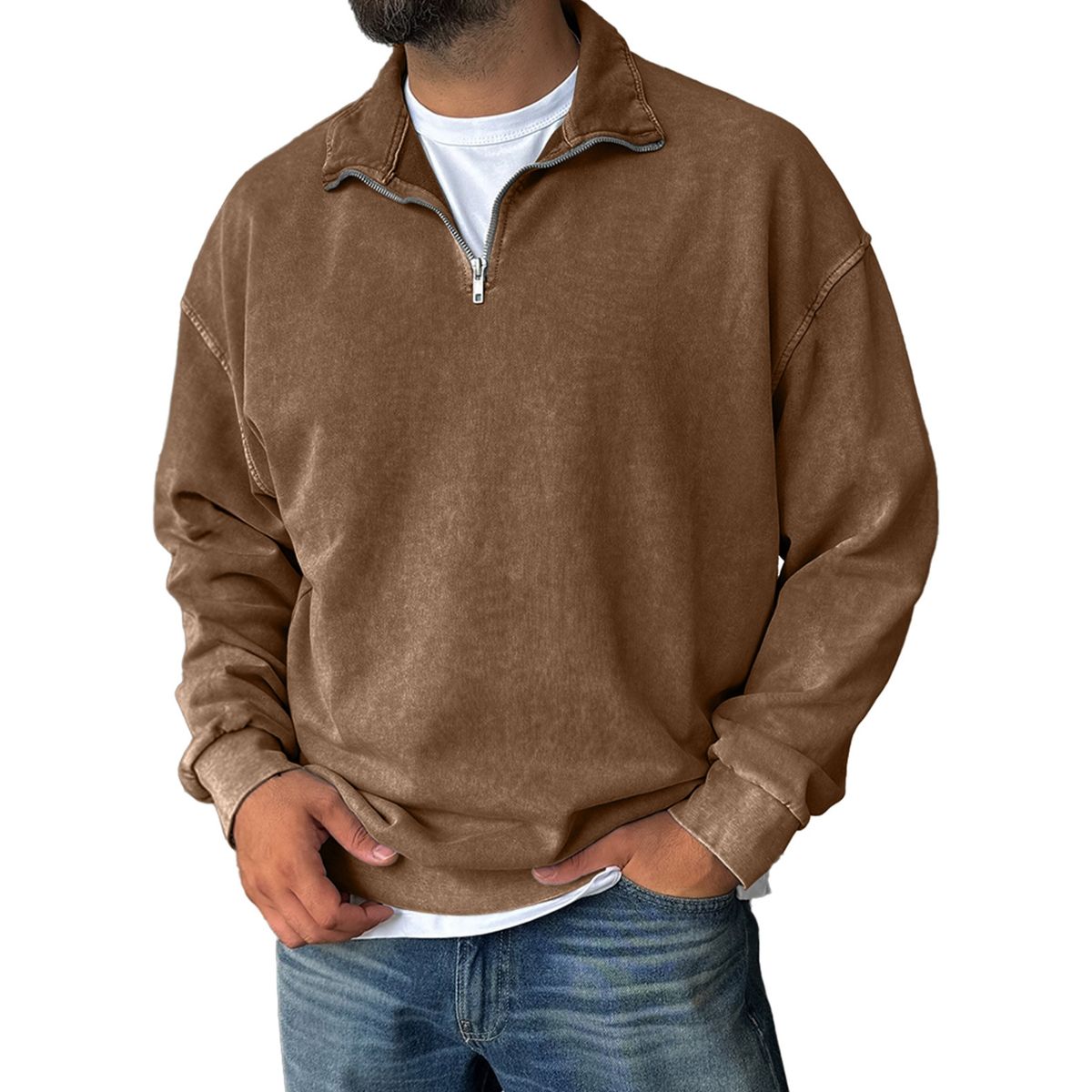 Man wearing a brown half-zip sweatshirt on a white background
