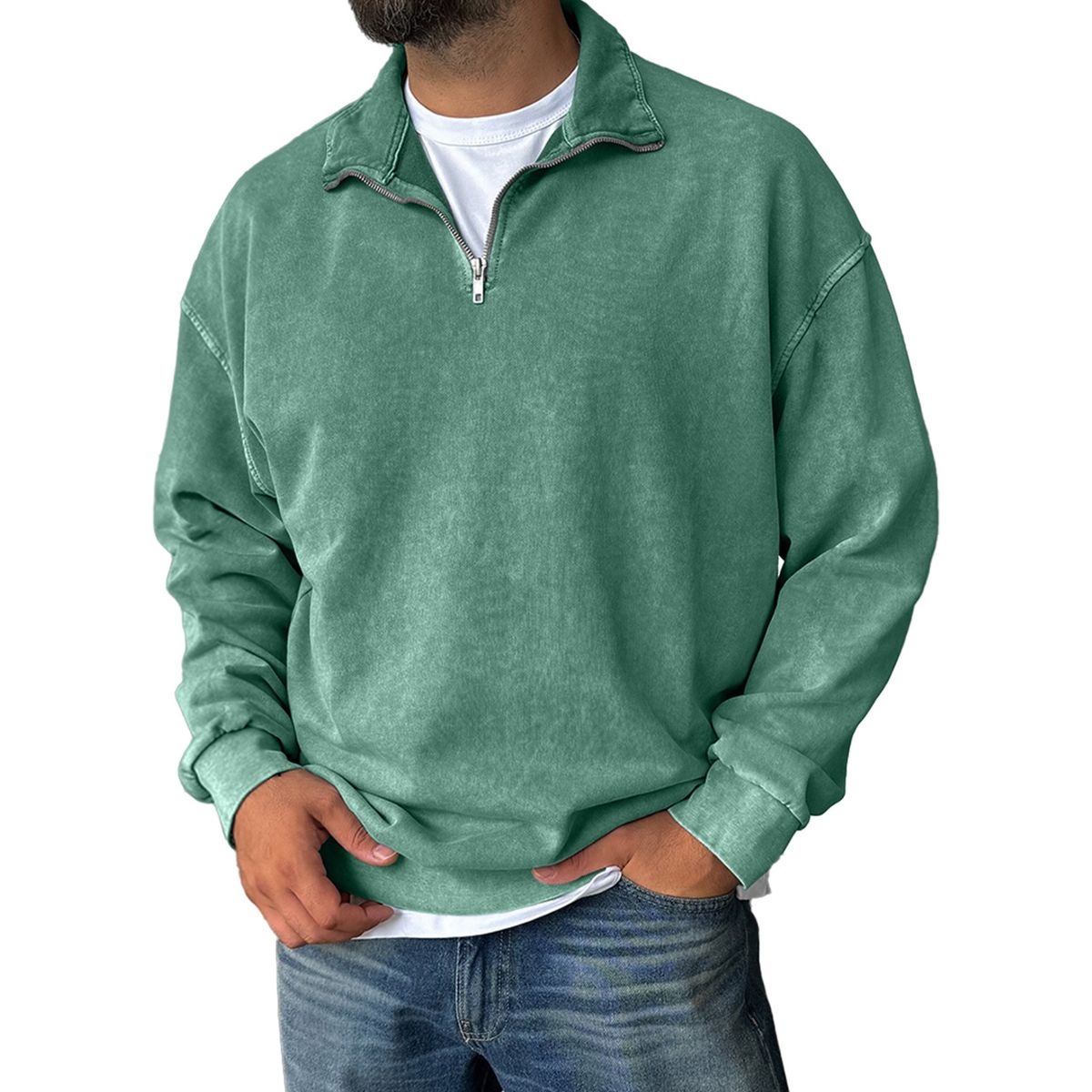 Green pullover with a zipper worn by a person on a white background