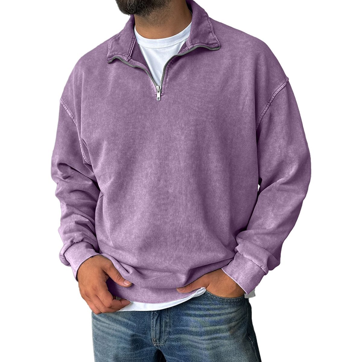 Person wearing a purple pullover with a white shirt underneath on a white background