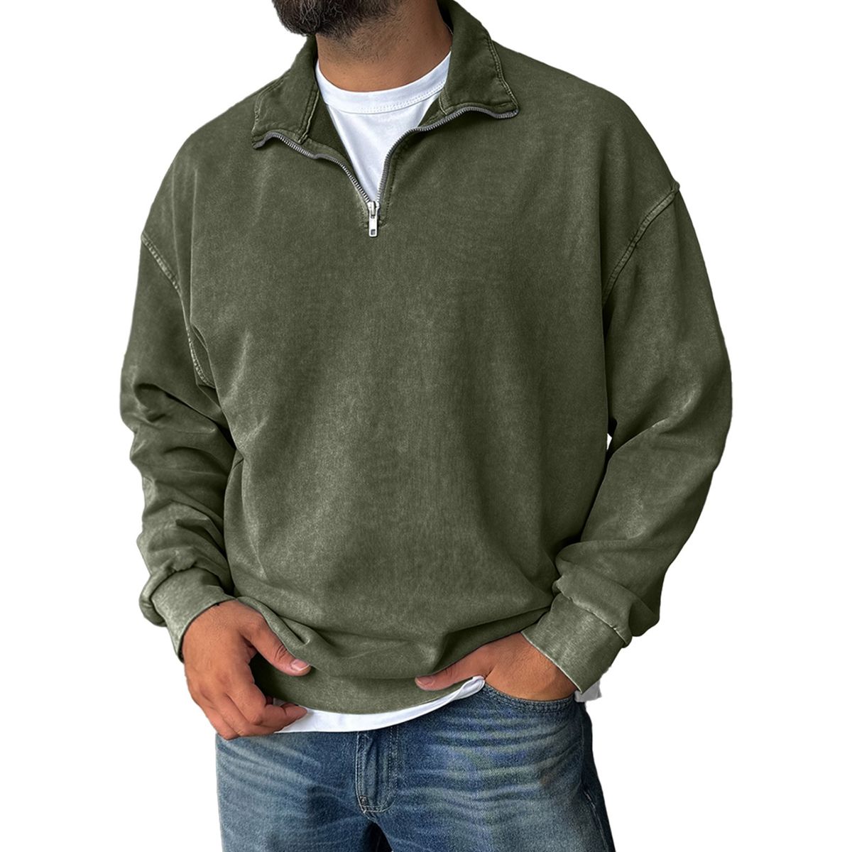 Person wearing a green pullover with a white shirt underneath on a white background