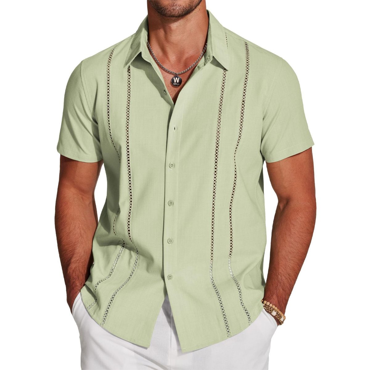 Light green short-sleeve shirt with decorative stitching on a white background