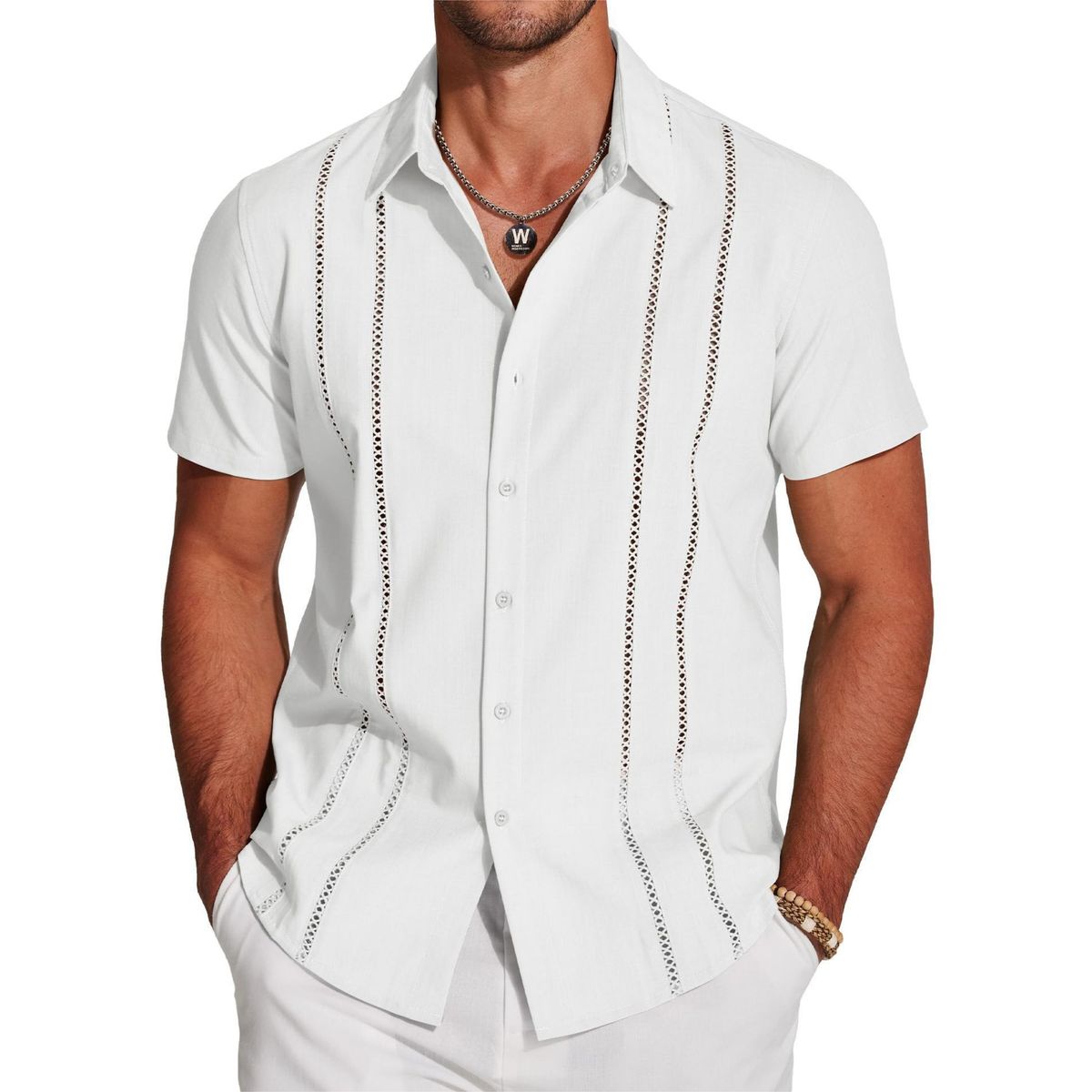 Man wearing a white short-sleeve shirt with decorative stitching on a white background